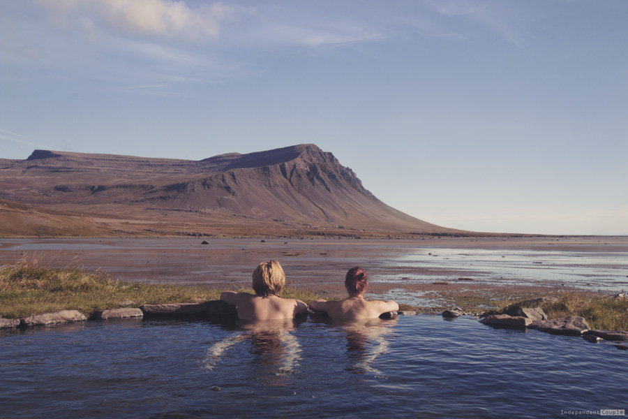 Swimming in the natural hot spring in Westfjords. Iceland travel, hot spring, natural hot spring in Iceland